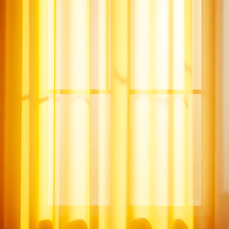 Yellow curtain with sunlight and shadow on it. Abstract background for design.の写真素材