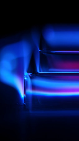 Blue flames of a gas burner on a black background. Macro.の写真素材