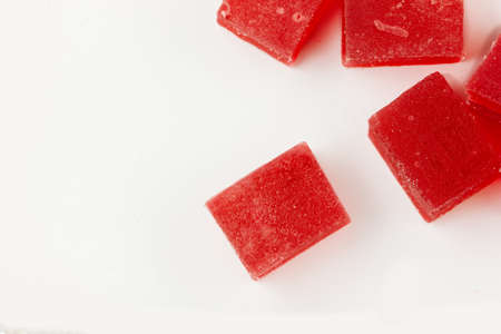 Red marmalade on white background. Fruit sweetsの写真素材