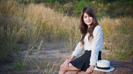 portrait of a girl in grass fieldの写真素材