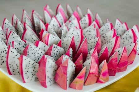 Slice of dragon fruit on a plateの写真素材