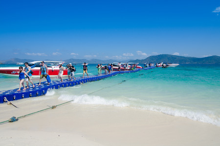Coral Island, Phuket - march 15  Traveler walking on the plastic box bridge go to the coral island on march 15, 2014 in Phuket, Thailand  Coral island is a popular day trip destination off the east coast of Phuket のeditorial素材
