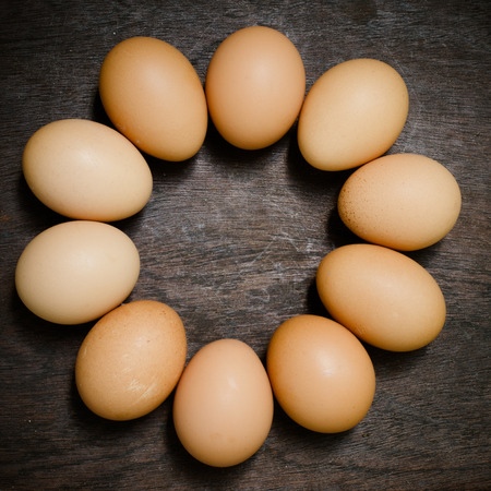 Eggs on wooden table background