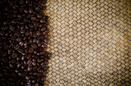 roasted coffee beans on bamboo backgroundの写真素材