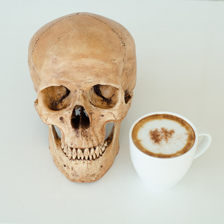 a cup of coffee and skullの写真素材