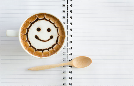 a cup of latte art on white paper backgroundの写真素材