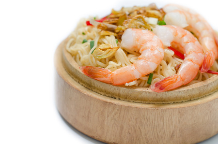 noodles with vegetables and prawn in wooden bowl