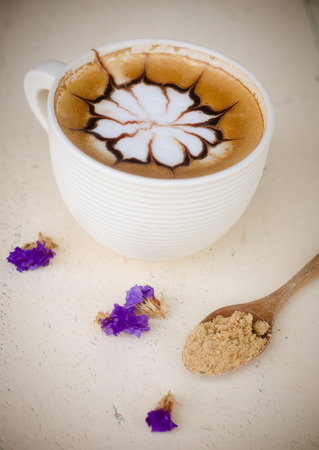 a cup of latte art on wooden table, vintage coffeeの写真素材