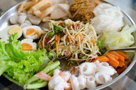 Papaya salad Som Tum on large plateの写真素材