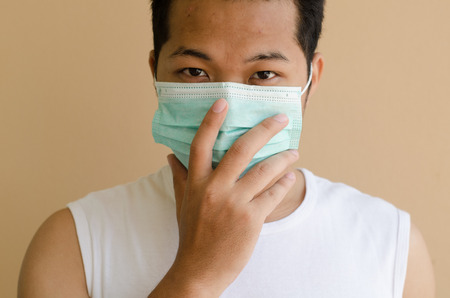 Asian man wearing a face maskの写真素材