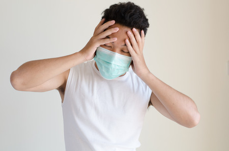 Asian man wearing a face maskの写真素材