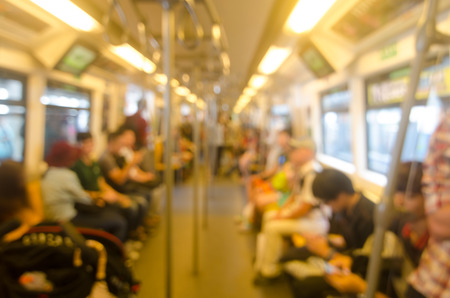 Blurred photo of passengers in sky trainの写真素材