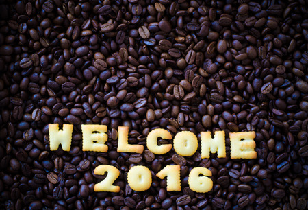 alphabet welcome 2016 made from bread cookies on coffee beans background