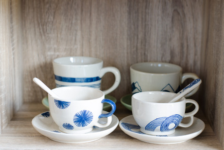 Porcelain cup on wooden backgroundの写真素材