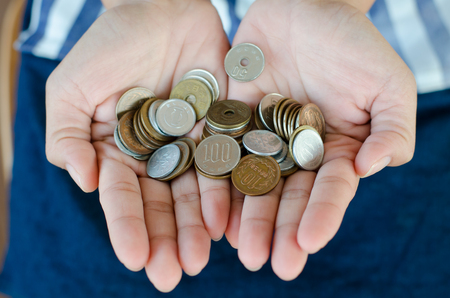 japan coin in handの写真素材