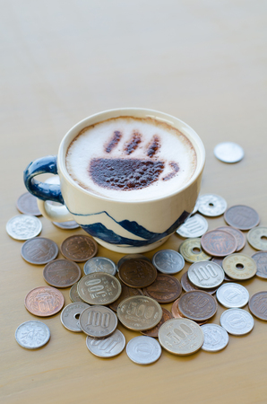 Hot coffee and Japanese yen coinの写真素材