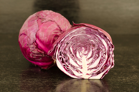 red cabbage on black wooden backgroundの写真素材