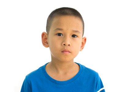 Little asian boy portrait close up face isolated on white backgroundの写真素材