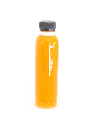 Orange juice in plastic bottle isolated on white background.の写真素材