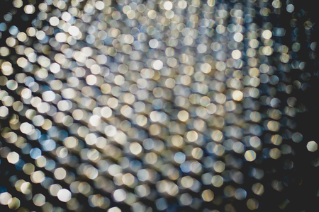 Abstract gold bokeh background, metal surface is not in focus