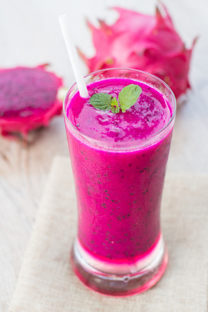 Dragon fruit smoothie on wooden background.food healthyの写真素材