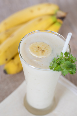 Banana smoothie in glass for healthy breakfastの写真素材