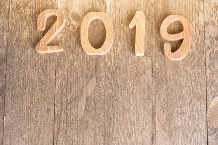 happy new year 2019 on wooden background.