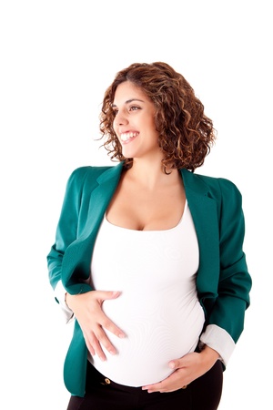 Beautiful pregnant woman showing her good shape over white backgroundの写真素材