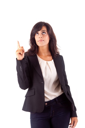 Smiling woman pointing up over white backgroundの写真素材