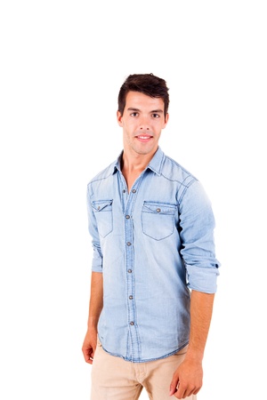 Portrait of handsome young man in casual clothes standing over white backgroundの写真素材
