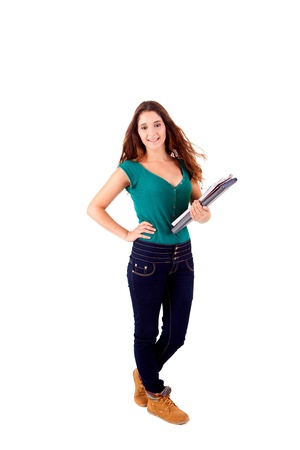 University girl holding books and smiling over white backgroundの写真素材