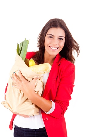 Young female holding a shopping bag on white background の写真素材
