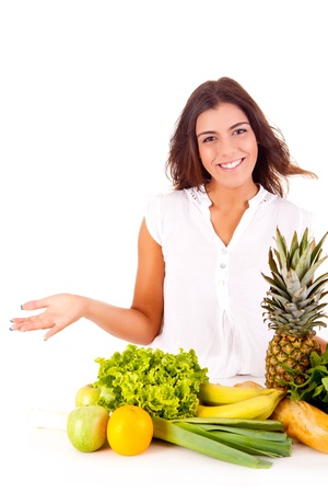 Happy young woman with fruits and vegetables on white backgroundの写真素材