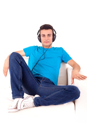 Beautiful young man listening to music on his headphonesの写真素材