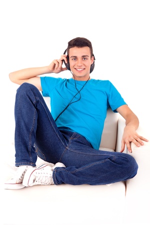 Beautiful young man listening to music on his headphonesの写真素材