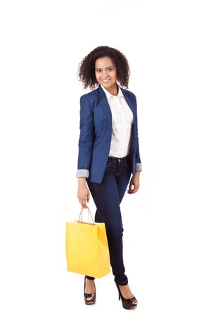 Beautiful african woman holding shopping bagsの写真素材
