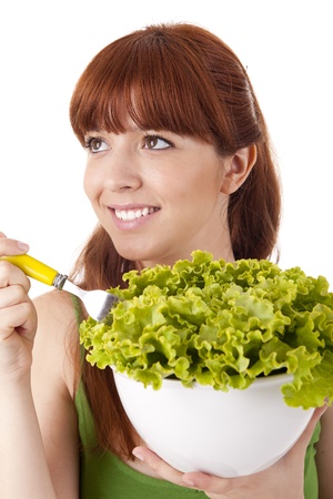 Beautiful woman with lettuce salad on white backgroundの写真素材