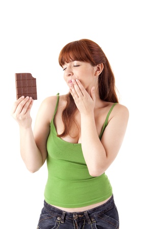 Beautiful young woman holding chocolate on white backgroundの写真素材