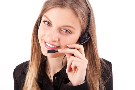 Beautiful call center employee smiling with a headset over whiteの写真素材