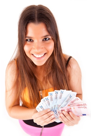 Portrait of a happy woman with a fan of Euros currency notesの写真素材
