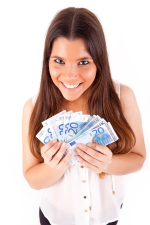 Portrait of a happy woman with a fan of Euros currency notesの写真素材