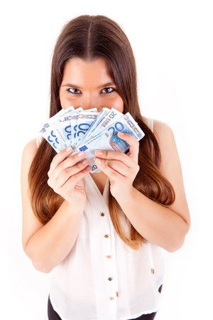 Portrait of a happy woman with a fan of Euros currency notesの写真素材
