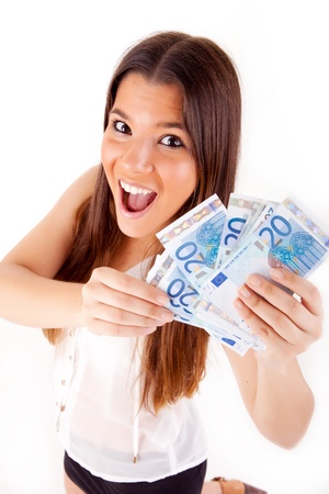 Portrait of a happy woman with a fan of Euros currency notesの写真素材