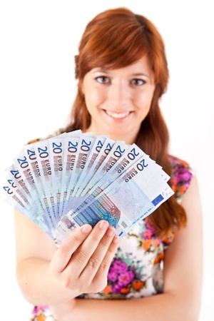 Happy woman showing Euros currency notes on white backgroundの写真素材