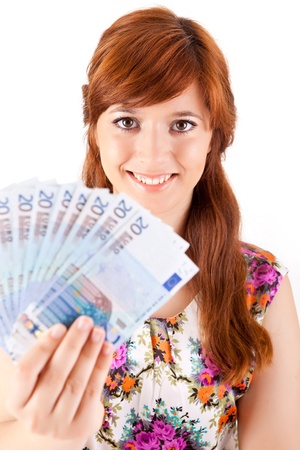 Happy woman showing Euros currency notes on white backgroundの写真素材