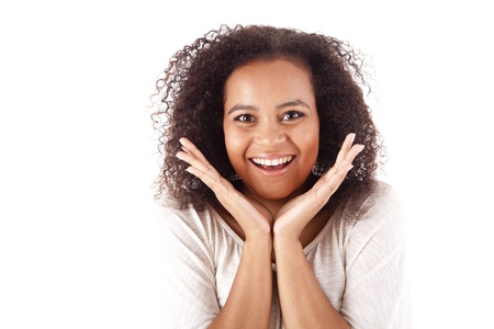 Surprised young african woman with hands over her mouthの写真素材