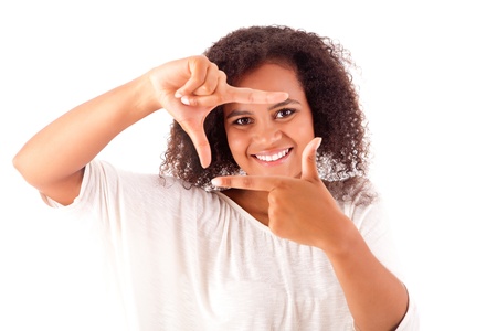 Beautiful african woman making frame with her handsの写真素材