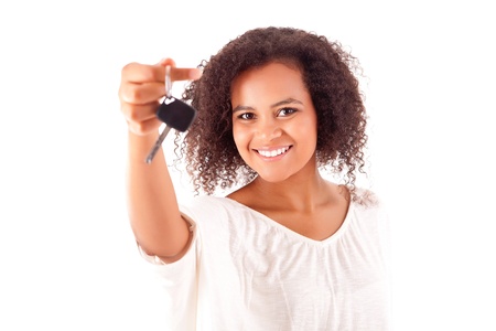 Beautiful african woman holding a car keyの写真素材