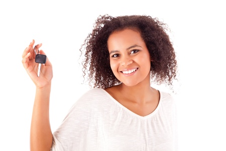 Beautiful african woman holding a car keyの写真素材