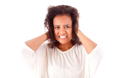 Frustrated and angry african woman over white backgroundの写真素材